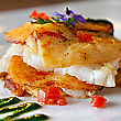 Mille-feuille of codfish and potatoes with an emulsion of borage